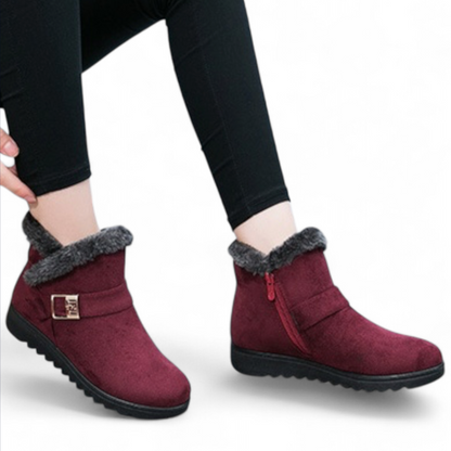 Elara ankle boots in black with adjustable hook-and-loop strap closure