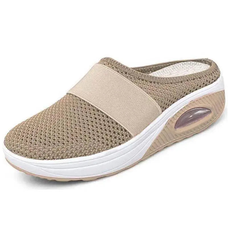 Diabetic-friendly women's slippers in beige, angled view