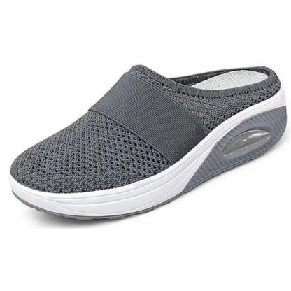 Oralie orthopedic slippers in blue, worn lifestyle shot