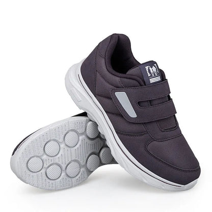 Women's orthopedic sneaker with velcro strap open for easy entry