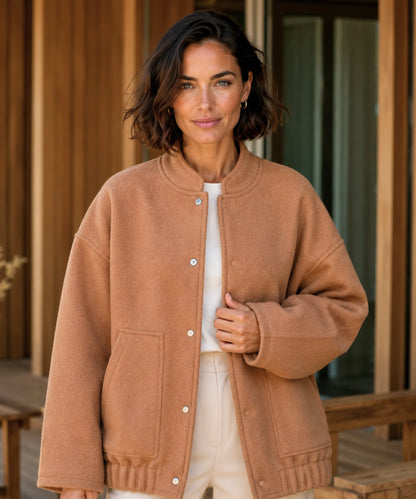 Detail of structured collar on grey bouclé bomber jacket