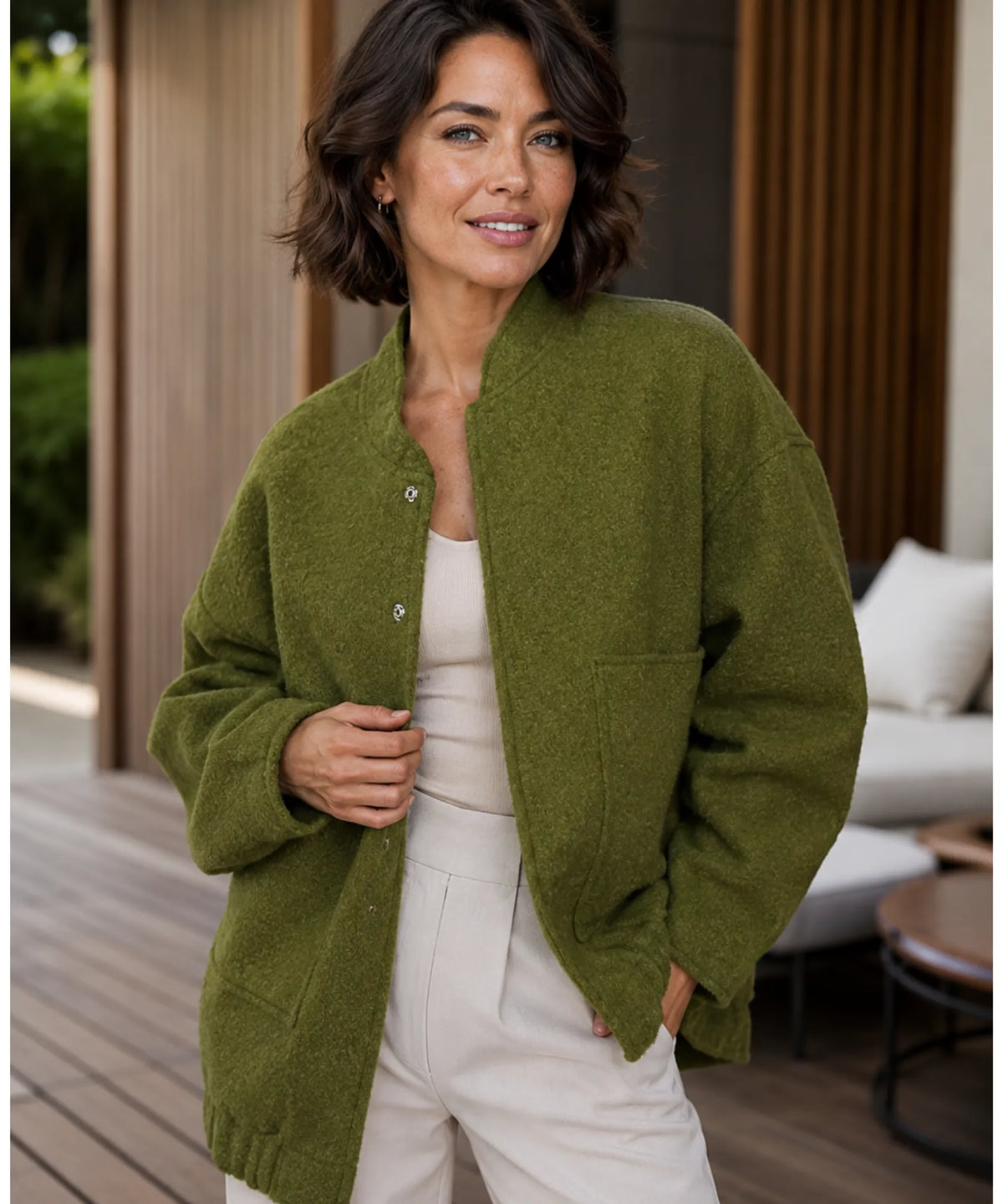 Front zipper detail on ivory women's bouclé bomber jacket