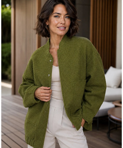 Front zipper detail on ivory women's bouclé bomber jacket