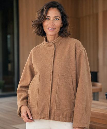 Back view of women's oversized bouclé bomber jacket in charcoal