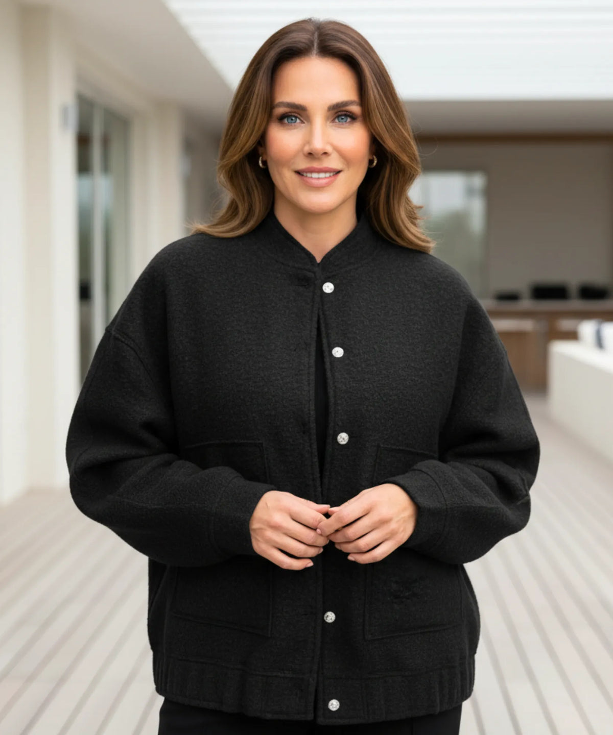 Woman wearing grey bouclé bomber jacket for a casual weekend look