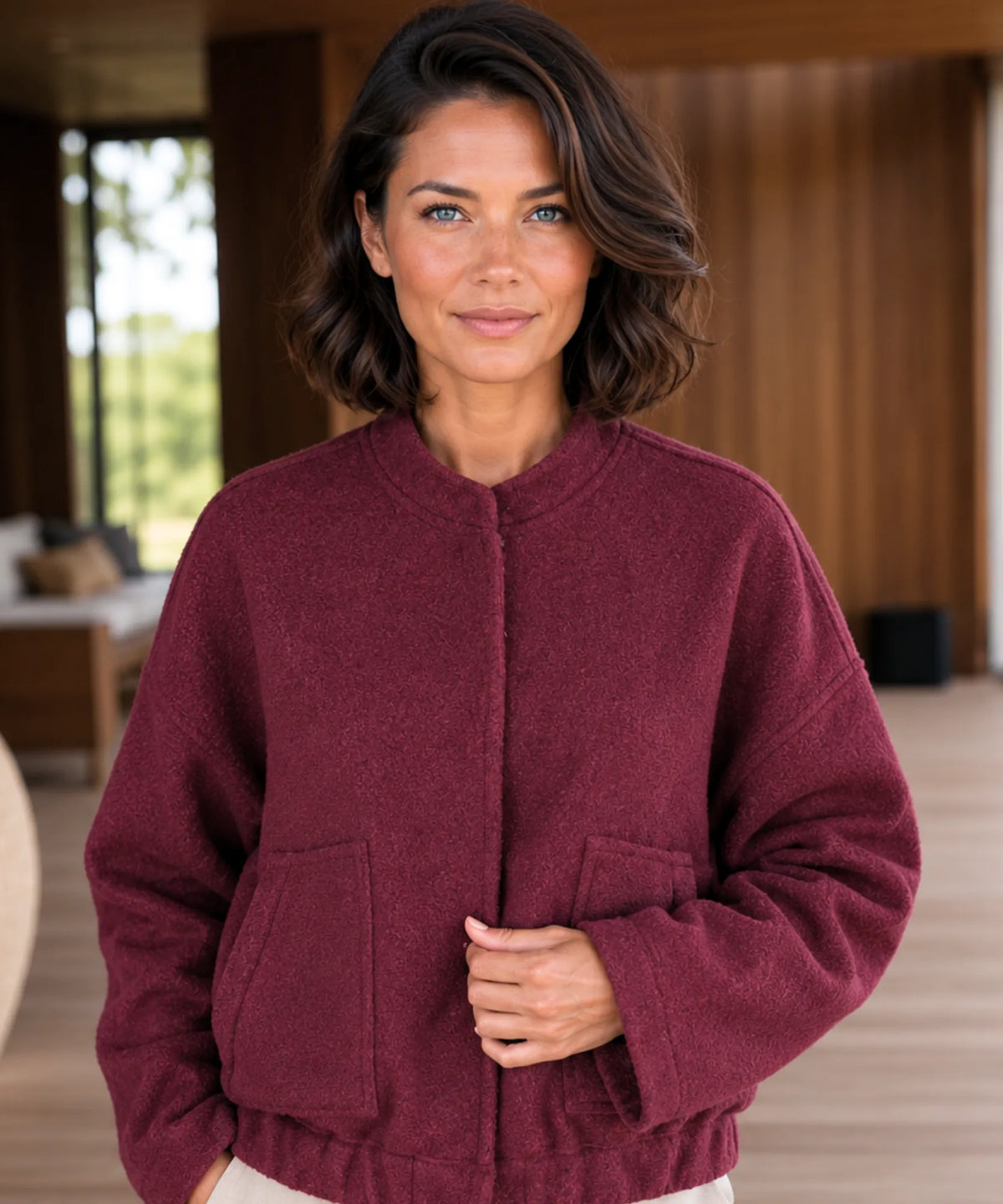 Camel oversized bouclé bomber jacket, side view showing side pockets