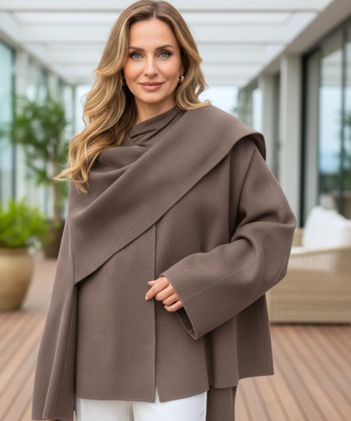 Elara wrap coat in taupe showing oversized sleeves and natural drape