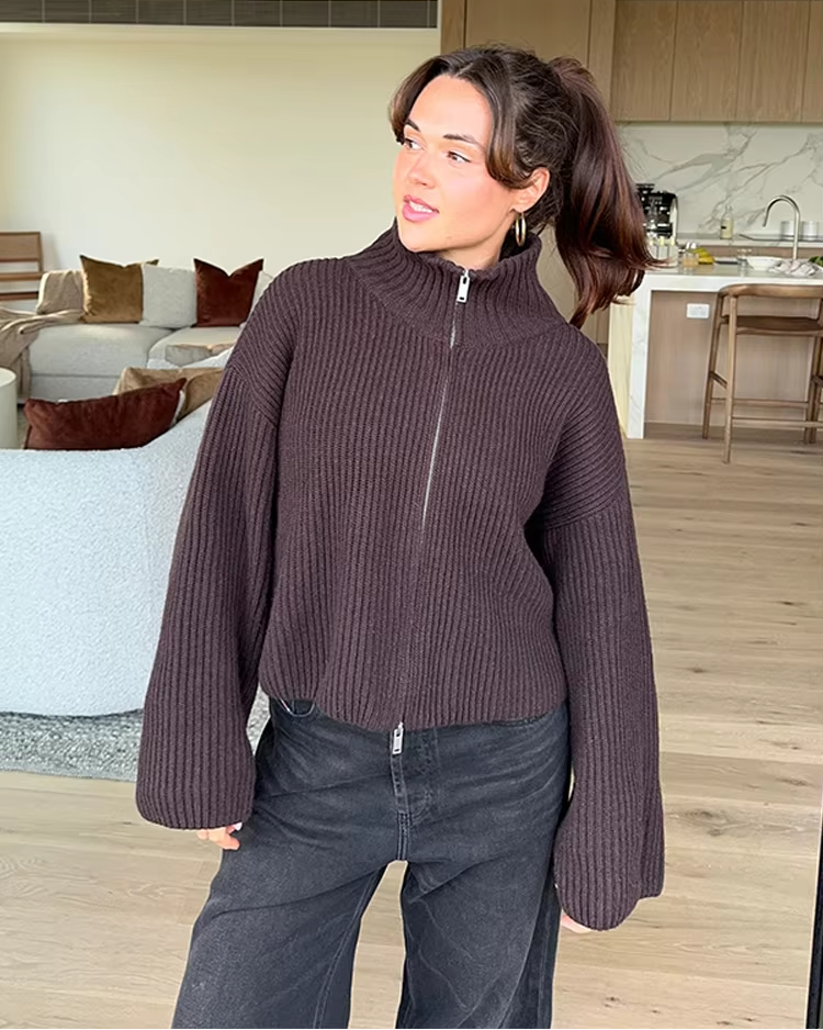 Zoria women's ribbed sweater showing turtleneck collar and fitted silhouette