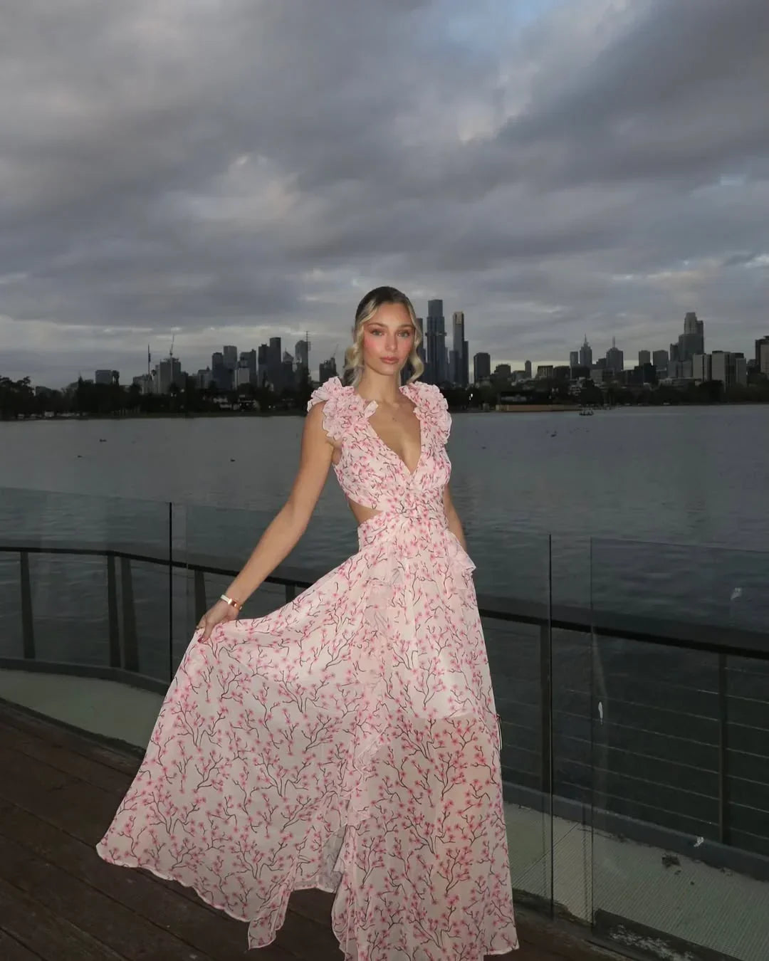 Sleeveless floral maxi dress in pink with elegant drape and flow
