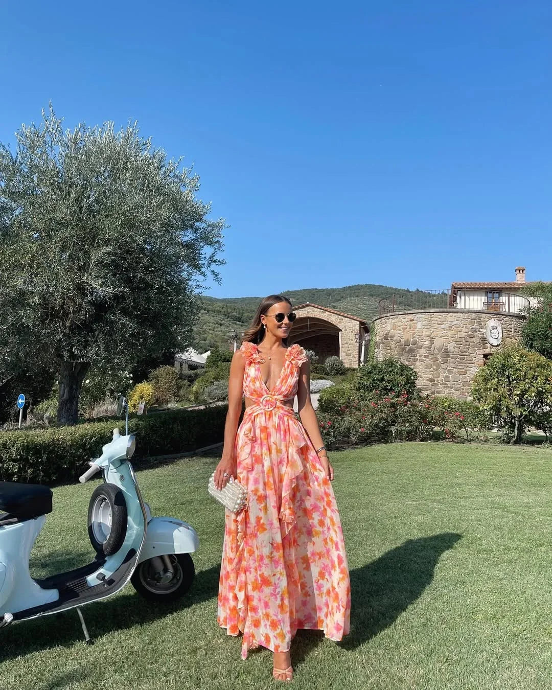 Front view of women's lightweight floral maxi dress in orange