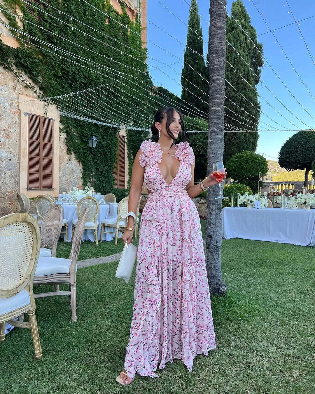 Pink floral maxi dress showcasing feminine silhouette and fit
