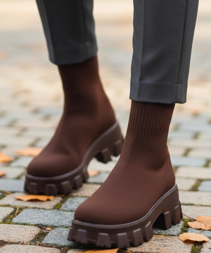 Overhead flat lay of 5 colourways of women's stretch knit lug sole boot