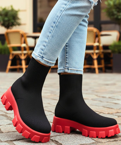 White women's stretch knit sock boot with chunky rubber lug sole