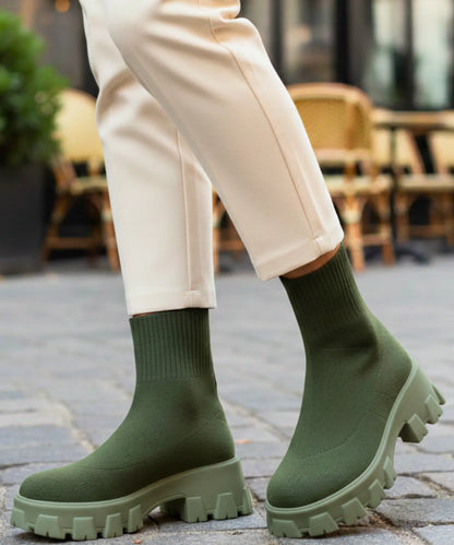 Women's knit sock boot mid-calf fit showing form-fitting stretch upper