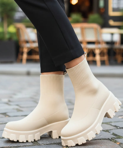 Side profile of women's slip-on sock boot with tonal chunky sole