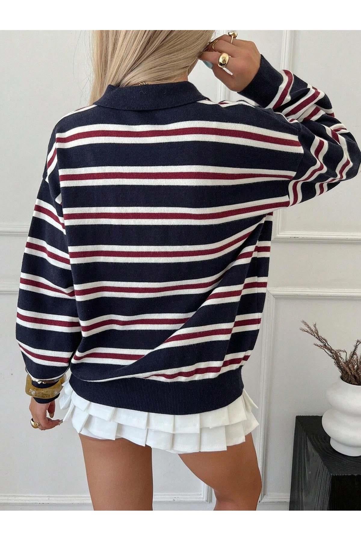 Detail shot of ribbed knit texture on women's striped jumper