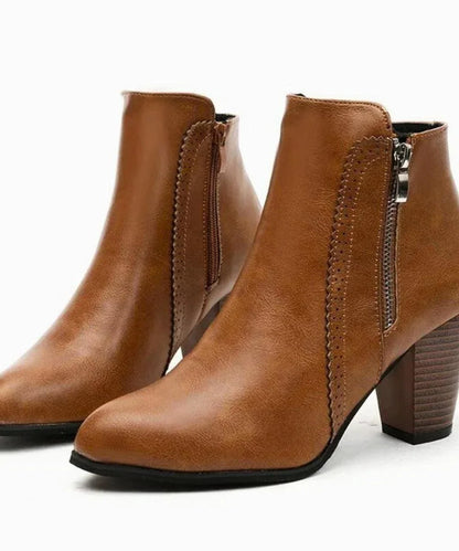 Serena black leather ankle boots styled for office and evening wear