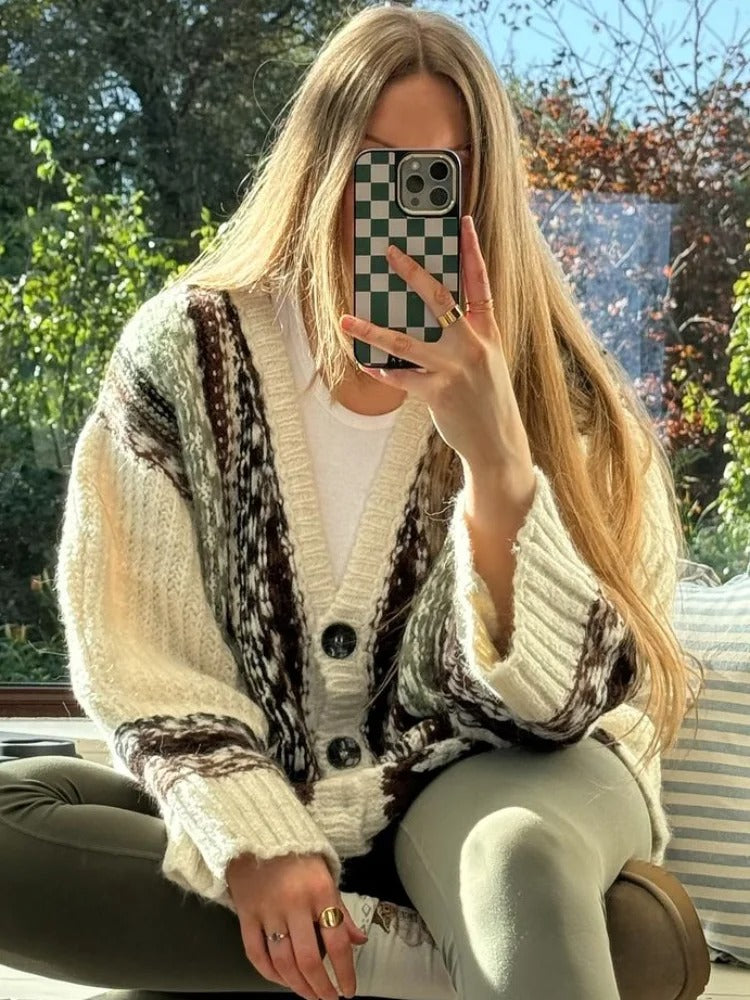 Close-up of cable knit crochet pattern on women's pullover sweater