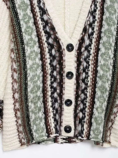 Women's cable knit sweater shown from the back, oversize silhouette