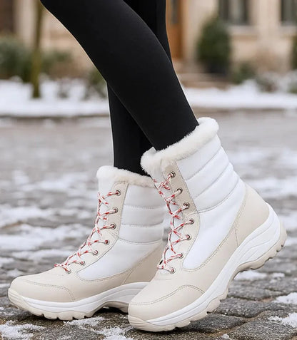 Kira women's waterproof snow boots in black with fur trim collar and lace-up front