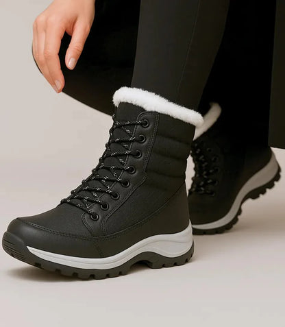 Women's waterproof snow boots in red with fur trim and quilted shaft