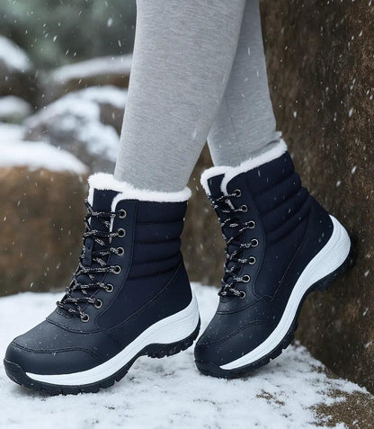 Black and white waterproof winter boots with non-slip outsole and mid-calf coverage