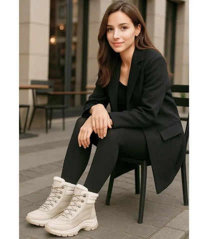 Women's lace-up snow boots in black with vegan leather toe and heel panels