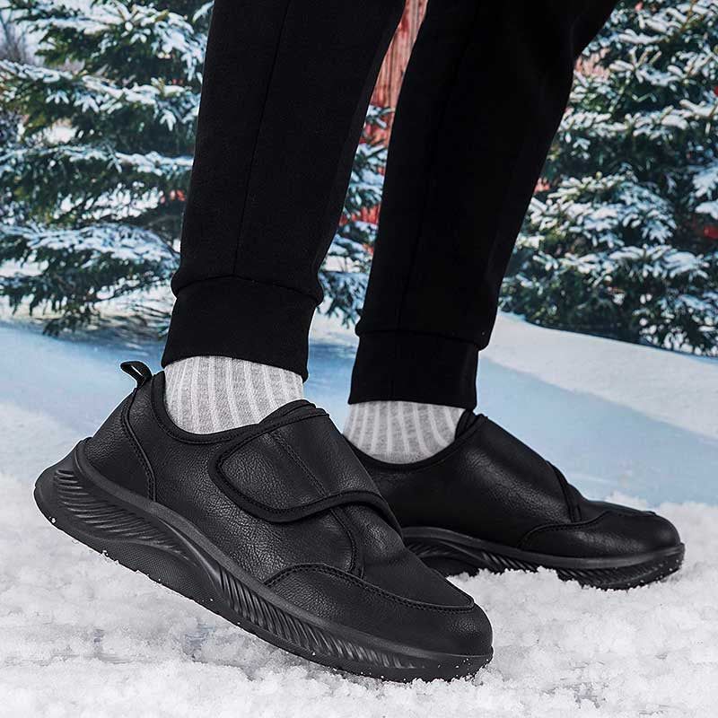 Pull tab detail on black women's slip-on winter sneaker